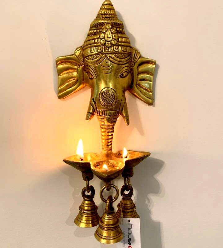 Ganesh Diya, Diya, Pooja Diya, Brass Diya, Diwali Gift, House2home, h2h, home Decor, Decorative, Brass Idol, Modern Diya, Wall Hanging Ganesha, Diya Hanging Ganesha, Brass idols, Brass religious statues, Brass deity figurines, Hindu brass idols, Traditional brass sculptures, Brass temple idols, Brass worship idols, Handcrafted brass idols, Antique brass idols, Artisanal brass idols, Indian brass idols, Brass deity idols, Sacred brass figurines, Brass god statues, Decorative brass idols, Custom brass idols, Brass home decor idols, Religious brass artifacts, Vintage brass idols, Spiritual brass sculptures, Hanging brass Ganesh diya, Wall-mounted Ganesh diya, Brass Ganesha lamp decor, Wall-hung brass deity diya, Ganesh diya wall art, Brass Ganpati oil lamp, Ganesha diya sculpture, Wall decor with diya, Brass Ganesh deepam, Hanging Ganapati diya, Brass Ganesha wall piece, Ganesh oil lamp art, Diya wall hanging, Brass Ganesh artwork, Wall-mounted diya sculpture