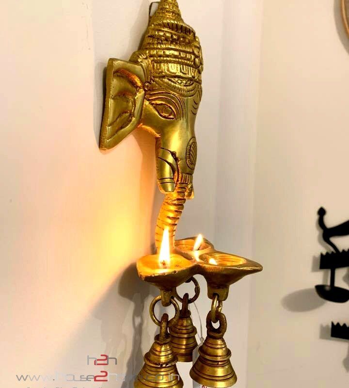 Ganesh Diya, Diya, Pooja Diya, Brass Diya, Diwali Gift, House2home, h2h, home Decor, Decorative, Brass Idol, Modern Diya, Wall Hanging Ganesha, Diya Hanging Ganesha, Brass idols, Brass religious statues, Brass deity figurines, Hindu brass idols, Traditional brass sculptures, Brass temple idols, Brass worship idols, Handcrafted brass idols, Antique brass idols, Artisanal brass idols, Indian brass idols, Brass deity idols, Sacred brass figurines, Brass god statues, Decorative brass idols, Custom brass idols, Brass home decor idols, Religious brass artifacts, Vintage brass idols, Spiritual brass sculptures, Hanging brass Ganesh diya, Wall-mounted Ganesh diya, Brass Ganesha lamp decor, Wall-hung brass deity diya, Ganesh diya wall art, Brass Ganpati oil lamp, Ganesha diya sculpture, Wall decor with diya, Brass Ganesh deepam, Hanging Ganapati diya, Brass Ganesha wall piece, Ganesh oil lamp art, Diya wall hanging, Brass Ganesh artwork, Wall-mounted diya sculpture