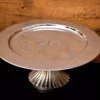 Steel Cake Stand With Ribbed Bottom - 13x6 inch Chrome 16 single tier fruit stand, single tier Hamper, single tier stand, Artistic Diwali gifting, Best Handicraft manufacture, Best metal handicrafts Moradabad, Cake Stand manufacturer, center table decor, Chocolate Hamper, cup cake stand, Custom metal gifts, Moradabad Manufacturer, Metal Cake Stand Manufacturer, Metal cake stand, Customized Diwali Gifts, cute hamper, decor, decorative, decorative hamper, Decorative metal items Manufacturer Moradabad, decorative packing, Dining table Organizer, Diwali Hamper, Diwali DIY gifts, Diwali Gift, diwali hamper, Metal fruit stand, Unique fruit Stand, dry fruit Hamper, dry fruit pack, Dry Fruit Packing, Dry Fruit Stand, dry fruit tray, Wedding Hamper, Rakhi Hampers, Wedding Gifts, Single-tier fruit arrangement, elegant platter, Fruit Platter, Fruit Stand, Steel Cake Stand, Gift Distribution Platter, gifting Hampers, h2h, Hammered Plate, Hamper Basket, Hamper Stand, Hamper Pack, Hamper Packing, Handcrafted Diwali decorations, handicraft, Handicrafts Manufacturer, handmade, Handmade Diwali gifts, festive décor and gifting, Multipurpose cake stand, Holiday Gift Hamper, Holiday Hamper, holiday pack, table decor, House 2 home, house warming gifts, House2home, Househome, Manufacturer, Metal art ware Moradabad, Metal gift manufacturers in Moradabad, Metal Handicraft Manufacturer, Metal Handicrafts, Metal ware manufacturers in India, Modern Platter, Modern hamper, Hamper Wholesaler in Moradabad, Moradabad brassware gifts, Moradabad handicraft exporters, Metal ware Manufacturers Moradabad, Metal Crafts Manufacturer in Moradabad, metal gift whole sellers in Moradabad, Moradabad metal gifts Manufacture & Whole seller, Moradabad Metal Home Decor, Moradabad Metal Hamper, metal hamper Manufacturer, Moradabad metal ware exporter, metal ware industry, Moradabad Metal ware Manufacturer, Moradabad meta crafts, Metal artisans, Multi-tier fruit server, metal cake stand Fruit Stand, Packing Hamper, Personalized Diwali gifts, Metal Platter Stand, Return Gift, Serving Platter, Snack Serving Stand, Solid metal cake stand, table Decorative & utility, utility gifts, Tiered fruit organizer, Tiered fruit storage, Traditional handmade Diwali gifts. Moradabad Metal Gifts Wholeseller, Modern metal crafts Moradabad, Single-layer fruit centerpiece, Single-level fruit display, fruit tray with Stand, Single-tier fruit holder, Single tier fruit stand, Single tiered fruit presentation, Unique handmade Diwali items, Modern metal cake stand, Wedding Gift, Wedding Hamper, Wedding Pack, Metal cake pedestal, Metal cake display, Metal cake holder, Metal cake platter, Metal cake server, metal cake stand, Metal Cake Stand Manufacturer, Metal cupcake stand, Metal dessert stand, Metal Hamper, Metal Handicrafts Manufacturer, Metal tiered cake stand, Dessert Hamper, Sweets Hamper