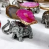 Small Silver Decorative Elephant, Silver Elephant Figurine, Decorative Elephant Sculpture, Elephant Ornament for Home Decor, Silver Elephant Centerpiece, Vastu Elephant Statue, Giftable Silver Elephant, Elephant Decor for Hampers, Metallic Elephant Home Accent, Elegant Elephant Decor Piece, Handcrafted Silver Elephant, Silver Elephant for Living Room, Lucky Elephant Decor, Feng Shui Elephant Decoration, Miniature Silver Elephant, Silver Elephant Desk Decor, Cultural Elephant Figurine, Silver Plated Elephant, Artisan Elephant Sculpture, Indian Themed Elephant Decor, Small Elephant, Agate, Candle Holder, Hamper Decorative, Hamper Filler, Silverware, German Silver Elephant, Diwali Gift, Deor, Silver Elephant, Mutli Color Agate, h2h, Decorative, Here are the keywords separated by commas: Small Metal Elephant with Agate Stone for Gifting, Agate Stone Topped Elephant for Hampers, Decorative Metal Elephant with Agate for Gifts, Miniature Metal Elephant with Agate for Hamper Packaging, Agate Decor Elephant Statue for Gift Baskets, Metal Elephant Figurine with Agate for Gifting, Small Agate Stone Elephant for Hampers, Agate-Topped Metal Elephant for Gift Sets, Elephant Ornament with Agate Stone for Hampers, Agate Embedded Metal Elephant for Gift Packaging, Metal Elephant with Agate Accents for Hampers, Agate Stone Decor Elephant for Gift Wrapping, Artisan Metal Elephant with Agate Stone for Gifts, Agate Crystal Elephant Figurine for Hampers, Unique Agate Topped Elephant for Gifting, Small Elephant with Agate Stone for Gift Boxes, Metal Elephant with Agate Gemstone for Hamper Decoration, Handcrafted Agate Stone Elephant for Gifts, Agate Decorated Mini Elephant for Hamper Gifts, Metal Elephant with Agate Crystal for Gift Baskets