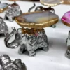 Small Silver Decorative Elephant, Silver Elephant Figurine, Decorative Elephant Sculpture, Elephant Ornament for Home Decor, Silver Elephant Centerpiece, Vastu Elephant Statue, Giftable Silver Elephant, Elephant Decor for Hampers, Metallic Elephant Home Accent, Elegant Elephant Decor Piece, Handcrafted Silver Elephant, Silver Elephant for Living Room, Lucky Elephant Decor, Feng Shui Elephant Decoration, Miniature Silver Elephant, Silver Elephant Desk Decor, Cultural Elephant Figurine, Silver Plated Elephant, Artisan Elephant Sculpture, Indian Themed Elephant Decor, Small Elephant, Agate, Candle Holder, Hamper Decorative, Hamper Filler, Silverware, German Silver Elephant, Diwali Gift, Deor, Silver Elephant, Mutli Color Agate, h2h, Decorative, Here are the keywords separated by commas: Small Metal Elephant with Agate Stone for Gifting, Agate Stone Topped Elephant for Hampers, Decorative Metal Elephant with Agate for Gifts, Miniature Metal Elephant with Agate for Hamper Packaging, Agate Decor Elephant Statue for Gift Baskets, Metal Elephant Figurine with Agate for Gifting, Small Agate Stone Elephant for Hampers, Agate-Topped Metal Elephant for Gift Sets, Elephant Ornament with Agate Stone for Hampers, Agate Embedded Metal Elephant for Gift Packaging, Metal Elephant with Agate Accents for Hampers, Agate Stone Decor Elephant for Gift Wrapping, Artisan Metal Elephant with Agate Stone for Gifts, Agate Crystal Elephant Figurine for Hampers, Unique Agate Topped Elephant for Gifting, Small Elephant with Agate Stone for Gift Boxes, Metal Elephant with Agate Gemstone for Hamper Decoration, Handcrafted Agate Stone Elephant for Gifts, Agate Decorated Mini Elephant for Hamper Gifts, Metal Elephant with Agate Crystal for Gift Baskets