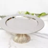 Steel Cake Stand With Ribbed Bottom - 13x6 inch Chrome 12 single tier fruit stand, single tier Hamper, single tier stand, Artistic Diwali gifting, Best Handicraft manufacture, Best metal handicrafts Moradabad, Cake Stand manufacturer, center table decor, Chocolate Hamper, cup cake stand, Custom metal gifts, Moradabad Manufacturer, Metal Cake Stand Manufacturer, Metal cake stand, Customized Diwali Gifts, cute hamper, decor, decorative, decorative hamper, Decorative metal items Manufacturer Moradabad, decorative packing, Dining table Organizer, Diwali Hamper, Diwali DIY gifts, Diwali Gift, diwali hamper, Metal fruit stand, Unique fruit Stand, dry fruit Hamper, dry fruit pack, Dry Fruit Packing, Dry Fruit Stand, dry fruit tray, Wedding Hamper, Rakhi Hampers, Wedding Gifts, Single-tier fruit arrangement, elegant platter, Fruit Platter, Fruit Stand, Steel Cake Stand, Gift Distribution Platter, gifting Hampers, h2h, Hammered Plate, Hamper Basket, Hamper Stand, Hamper Pack, Hamper Packing, Handcrafted Diwali decorations, handicraft, Handicrafts Manufacturer, handmade, Handmade Diwali gifts, festive décor and gifting, Multipurpose cake stand, Holiday Gift Hamper, Holiday Hamper, holiday pack, table decor, House 2 home, house warming gifts, House2home, Househome, Manufacturer, Metal art ware Moradabad, Metal gift manufacturers in Moradabad, Metal Handicraft Manufacturer, Metal Handicrafts, Metal ware manufacturers in India, Modern Platter, Modern hamper, Hamper Wholesaler in Moradabad, Moradabad brassware gifts, Moradabad handicraft exporters, Metal ware Manufacturers Moradabad, Metal Crafts Manufacturer in Moradabad, metal gift whole sellers in Moradabad, Moradabad metal gifts Manufacture & Whole seller, Moradabad Metal Home Decor, Moradabad Metal Hamper, metal hamper Manufacturer, Moradabad metal ware exporter, metal ware industry, Moradabad Metal ware Manufacturer, Moradabad meta crafts, Metal artisans, Multi-tier fruit server, metal cake stand Fruit Stand, Packing Hamper, Personalized Diwali gifts, Metal Platter Stand, Return Gift, Serving Platter, Snack Serving Stand, Solid metal cake stand, table Decorative & utility, utility gifts, Tiered fruit organizer, Tiered fruit storage, Traditional handmade Diwali gifts. Moradabad Metal Gifts Wholeseller, Modern metal crafts Moradabad, Single-layer fruit centerpiece, Single-level fruit display, fruit tray with Stand, Single-tier fruit holder, Single tier fruit stand, Single tiered fruit presentation, Unique handmade Diwali items, Modern metal cake stand, Wedding Gift, Wedding Hamper, Wedding Pack, Metal cake pedestal, Metal cake display, Metal cake holder, Metal cake platter, Metal cake server, metal cake stand, Metal Cake Stand Manufacturer, Metal cupcake stand, Metal dessert stand, Metal Hamper, Metal Handicrafts Manufacturer, Metal tiered cake stand, Dessert Hamper, Sweets Hamper