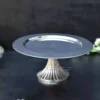 Steel Cake Stand With Ribbed Bottom - 13x6 inch Chrome 13 single tier fruit stand, single tier Hamper, single tier stand, Artistic Diwali gifting, Best Handicraft manufacture, Best metal handicrafts Moradabad, Cake Stand manufacturer, center table decor, Chocolate Hamper, cup cake stand, Custom metal gifts, Moradabad Manufacturer, Metal Cake Stand Manufacturer, Metal cake stand, Customized Diwali Gifts, cute hamper, decor, decorative, decorative hamper, Decorative metal items Manufacturer Moradabad, decorative packing, Dining table Organizer, Diwali Hamper, Diwali DIY gifts, Diwali Gift, diwali hamper, Metal fruit stand, Unique fruit Stand, dry fruit Hamper, dry fruit pack, Dry Fruit Packing, Dry Fruit Stand, dry fruit tray, Wedding Hamper, Rakhi Hampers, Wedding Gifts, Single-tier fruit arrangement, elegant platter, Fruit Platter, Fruit Stand, Steel Cake Stand, Gift Distribution Platter, gifting Hampers, h2h, Hammered Plate, Hamper Basket, Hamper Stand, Hamper Pack, Hamper Packing, Handcrafted Diwali decorations, handicraft, Handicrafts Manufacturer, handmade, Handmade Diwali gifts, festive décor and gifting, Multipurpose cake stand, Holiday Gift Hamper, Holiday Hamper, holiday pack, table decor, House 2 home, house warming gifts, House2home, Househome, Manufacturer, Metal art ware Moradabad, Metal gift manufacturers in Moradabad, Metal Handicraft Manufacturer, Metal Handicrafts, Metal ware manufacturers in India, Modern Platter, Modern hamper, Hamper Wholesaler in Moradabad, Moradabad brassware gifts, Moradabad handicraft exporters, Metal ware Manufacturers Moradabad, Metal Crafts Manufacturer in Moradabad, metal gift whole sellers in Moradabad, Moradabad metal gifts Manufacture & Whole seller, Moradabad Metal Home Decor, Moradabad Metal Hamper, metal hamper Manufacturer, Moradabad metal ware exporter, metal ware industry, Moradabad Metal ware Manufacturer, Moradabad meta crafts, Metal artisans, Multi-tier fruit server, metal cake stand Fruit Stand, Packing Hamper, Personalized Diwali gifts, Metal Platter Stand, Return Gift, Serving Platter, Snack Serving Stand, Solid metal cake stand, table Decorative & utility, utility gifts, Tiered fruit organizer, Tiered fruit storage, Traditional handmade Diwali gifts. Moradabad Metal Gifts Wholeseller, Modern metal crafts Moradabad, Single-layer fruit centerpiece, Single-level fruit display, fruit tray with Stand, Single-tier fruit holder, Single tier fruit stand, Single tiered fruit presentation, Unique handmade Diwali items, Modern metal cake stand, Wedding Gift, Wedding Hamper, Wedding Pack, Metal cake pedestal, Metal cake display, Metal cake holder, Metal cake platter, Metal cake server, metal cake stand, Metal Cake Stand Manufacturer, Metal cupcake stand, Metal dessert stand, Metal Hamper, Metal Handicrafts Manufacturer, Metal tiered cake stand, Dessert Hamper, Sweets Hamper