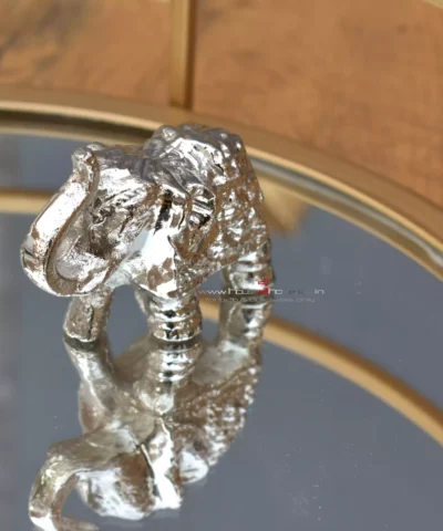 Small Silver Decorative Elephant, Silver Elephant Figurine, Decorative Elephant Sculpture, Elephant Ornament for Home Decor, Silver Elephant Centerpiece, Vastu Elephant Statue, Giftable Silver Elephant, Elephant Decor for Hampers, Metallic Elephant Home Accent, Elegant Elephant Decor Piece, Handcrafted Silver Elephant, Silver Elephant for Living Room, Lucky Elephant Decor, Feng Shui Elephant Decoration, Miniature Silver Elephant, Silver Elephant Desk Decor, Cultural Elephant Figurine, Silver Plated Elephant, Artisan Elephant Sculpture, Indian Themed Elephant Decor, Small Elephant, Agate, Candle Holder, Hamper Decorative, Hamper Filler, Silverware, German Silver Elephant, Diwali Gift, Deor, Silver Elephant, Mutli Color Agate, h2h, Decorative, Here are the keywords separated by commas: Small Metal Elephant with Agate Stone for Gifting, Agate Stone Topped Elephant for Hampers, Decorative Metal Elephant with Agate for Gifts, Miniature Metal Elephant with Agate for Hamper Packaging, Agate Decor Elephant Statue for Gift Baskets, Metal Elephant Figurine with Agate for Gifting, Small Agate Stone Elephant for Hampers, Agate-Topped Metal Elephant for Gift Sets, Elephant Ornament with Agate Stone for Hampers, Agate Embedded Metal Elephant for Gift Packaging, Metal Elephant with Agate Accents for Hampers, Agate Stone Decor Elephant for Gift Wrapping, Artisan Metal Elephant with Agate Stone for Gifts, Agate Crystal Elephant Figurine for Hampers, Unique Agate Topped Elephant for Gifting, Small Elephant with Agate Stone for Gift Boxes, Metal Elephant with Agate Gemstone for Hamper Decoration, Handcrafted Agate Stone Elephant for Gifts, Agate Decorated Mini Elephant for Hamper Gifts, Metal Elephant with Agate Crystal for Gift Baskets