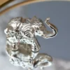 Decorative Elephant 3x1.5x1 inch Chrome Finished 15 Small Silver Decorative Elephant, Silver Elephant Figurine, Decorative Elephant Sculpture, Elephant Ornament for Home Decor, Silver Elephant Centerpiece, Vastu Elephant Statue, Giftable Silver Elephant, Elephant Decor for Hampers, Metallic Elephant Home Accent, Elegant Elephant Decor Piece, Handcrafted Silver Elephant, Silver Elephant for Living Room, Lucky Elephant Decor, Feng Shui Elephant Decoration, Miniature Silver Elephant, Silver Elephant Desk Decor, Cultural Elephant Figurine, Silver Plated Elephant, Artisan Elephant Sculpture, Indian Themed Elephant Decor, Small Elephant, Agate, Candle Holder, Hamper Decorative, Hamper Filler, Silverware, German Silver Elephant, Diwali Gift, Deor, Silver Elephant, Mutli Color Agate, h2h, Decorative, Here are the keywords separated by commas: Small Metal Elephant with Agate Stone for Gifting, Agate Stone Topped Elephant for Hampers, Decorative Metal Elephant with Agate for Gifts, Miniature Metal Elephant with Agate for Hamper Packaging, Agate Decor Elephant Statue for Gift Baskets, Metal Elephant Figurine with Agate for Gifting, Small Agate Stone Elephant for Hampers, Agate-Topped Metal Elephant for Gift Sets, Elephant Ornament with Agate Stone for Hampers, Agate Embedded Metal Elephant for Gift Packaging, Metal Elephant with Agate Accents for Hampers, Agate Stone Decor Elephant for Gift Wrapping, Artisan Metal Elephant with Agate Stone for Gifts, Agate Crystal Elephant Figurine for Hampers, Unique Agate Topped Elephant for Gifting, Small Elephant with Agate Stone for Gift Boxes, Metal Elephant with Agate Gemstone for Hamper Decoration, Handcrafted Agate Stone Elephant for Gifts, Agate Decorated Mini Elephant for Hamper Gifts, Metal Elephant with Agate Crystal for Gift Baskets