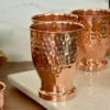 Polished copper glass set displayed for traditional Indian shaadi return gift hampers and ceremonies.
