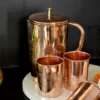 This elegant copper drinkware set serves as a sophisticated choice for luxury shaadi return gifts and trousseau.