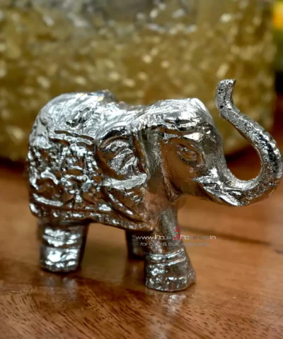 Small Silver Decorative Elephant, Silver Elephant Figurine, Decorative Elephant Sculpture, Elephant Ornament for Home Decor, Silver Elephant Centerpiece, Vastu Elephant Statue, Giftable Silver Elephant, Elephant Decor for Hampers, Metallic Elephant Home Accent, Elegant Elephant Decor Piece, Handcrafted Silver Elephant, Silver Elephant for Living Room, Lucky Elephant Decor, Feng Shui Elephant Decoration, Miniature Silver Elephant, Silver Elephant Desk Decor, Cultural Elephant Figurine, Silver Plated Elephant, Artisan Elephant Sculpture, Indian Themed Elephant Decor, Small Elephant, Agate, Candle Holder, Hamper Decorative, Hamper Filler, Silverware, German Silver Elephant, Diwali Gift, Deor, Silver Elephant, Mutli Color Agate, h2h, Decorative, Here are the keywords separated by commas: Small Metal Elephant with Agate Stone for Gifting, Agate Stone Topped Elephant for Hampers, Decorative Metal Elephant with Agate for Gifts, Miniature Metal Elephant with Agate for Hamper Packaging, Agate Decor Elephant Statue for Gift Baskets, Metal Elephant Figurine with Agate for Gifting, Small Agate Stone Elephant for Hampers, Agate-Topped Metal Elephant for Gift Sets, Elephant Ornament with Agate Stone for Hampers, Agate Embedded Metal Elephant for Gift Packaging, Metal Elephant with Agate Accents for Hampers, Agate Stone Decor Elephant for Gift Wrapping, Artisan Metal Elephant with Agate Stone for Gifts, Agate Crystal Elephant Figurine for Hampers, Unique Agate Topped Elephant for Gifting, Small Elephant with Agate Stone for Gift Boxes, Metal Elephant with Agate Gemstone for Hamper Decoration, Handcrafted Agate Stone Elephant for Gifts, Agate Decorated Mini Elephant for Hamper Gifts, Metal Elephant with Agate Crystal for Gift Baskets