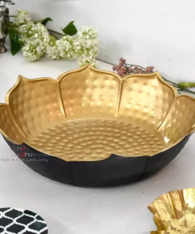 Urli, Lotus Urli, Petal Shaped Urli, Metal Urli, Hamper Basket, Gift Pack, Home Decor, Decorative, Party Decoration, Table Decor, house warming, house2home, h2h, flower decoration, lotus Urli, Hamper Pack, Gift Basket, Holiday Basket, parat, decor, decorative, flower decoration, home decor, diwali Decor, Return Gift, Diwali Gift, Here are keywords for a metal urli carved in two-tone black and gold, for decoration, gifting, and hamper purposes: Metal urli, Carved metal urli, Two-tone urli, Black and gold urli, Decorative metal urli, Gifting urli, Urli for decoration, Metal urli for hampers, Black gold carved urli, Elegant metal urli, Urli for home decor, Luxury metal urli, Dual-tone metal urli, Black and gold decorative urli, Urli for gifting, Carved urli for hampers, Urli centerpiece, Urli for festive decor, Metal decor urli, Black gold urli for gifts, Handcrafted metal urli, Stylish urli, Artistic metal urli, Premium metal urli, Modern metal urli, Decorative centerpiece urli, Urli for special occasions, Metal urli decor, Traditional metal urli, Urli for celebrations, Urli for wedding decor, Urli for events, Unique metal urli, Ornate metal urli, Black and gold centerpiece, Festive urli, Vintage style metal urli, Classic metal urli, Carved urli for decoration, Metal urli gift item, Elegant urli decor, Decorative gift urli, Dual-color metal urli, Black and gold ornament, Urli for luxury gifting, Decorative carved urli, Urli for home accents, Artistic carved urli, Modern decor urli, Premium urli for gifting, Two-tone carved urli, Metal Urli, Gold Urli, GOlden Bowl, Hammered Bowl, Decorative Urli, Home Decor, Diwali Decor, Decoration, house2home, h2h, Table Top, Lotus Metal