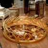 An elegant gold-finished tray, ideal as a centerpiece for premium wedding return gift hampers and shaadi trousseaus.