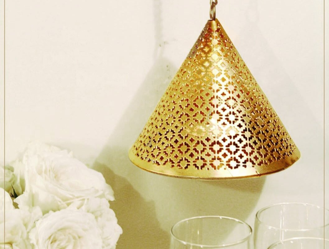Sophisticated brass hanging tea light holder suitable for premium corporate festive gifts and New Year employee rewards.