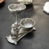 Elegant German silver double diya stand featuring an intricate elephant motif for traditional home decor and lighting.