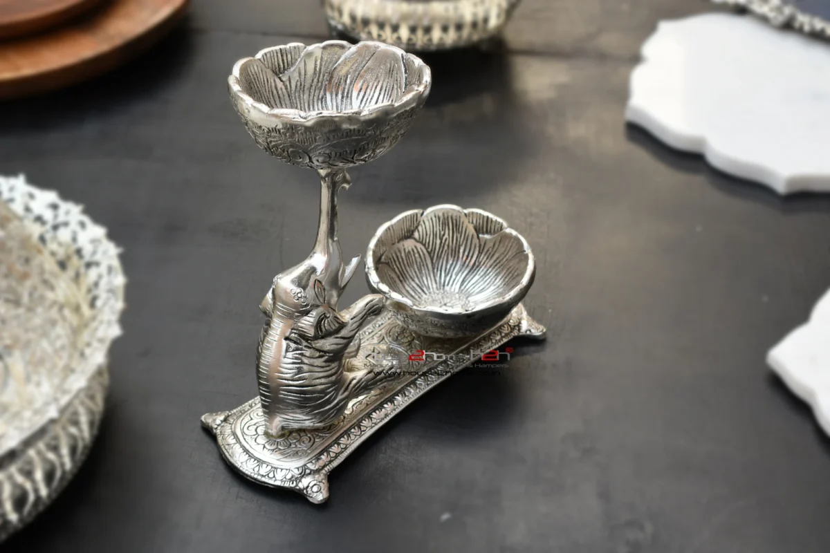 Elegant German silver double diya stand featuring an intricate elephant motif for traditional home decor and lighting.