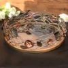 An artistic floral metal tray, ideal for Griha Pravesh gift sets and traditional pooja ceremony displays.