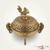 Intricately carved brass incense burner featuring a traditional peacock motif, crafted for premium home decor.