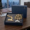 Sophisticated corporate gift set featuring brass deer and tree designs, ideal for professional branding events.