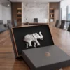 A luxury corporate gift set showcasing an intricate silver elephant figurine crafted by House2Home.