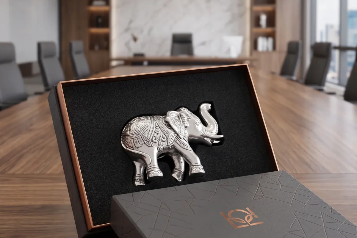 A luxury corporate gift set showcasing an intricate silver elephant figurine crafted by House2Home.