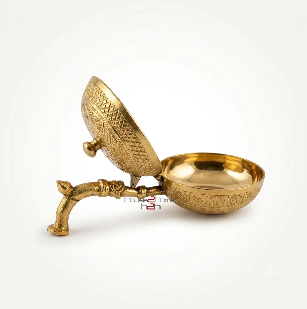 Handcrafted brass dhoop dani with ventilated lid and decorative handle for traditional incense rituals.
