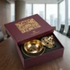An elegante brass Lobaan set showcasing fine metallic craftsmanship.