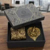 luxury metal gifting box containing a golden Ganesha idol leaf tray and ornate engraved utility container.