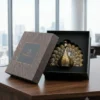 An elegant peacock ornament, perfect for sophisticated shaadi return gift hampers and wedding ceremony favors.