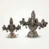 A set of two handcrafted German silver Venkateswara Swamy idols featuring ornate traditional metal engravings.