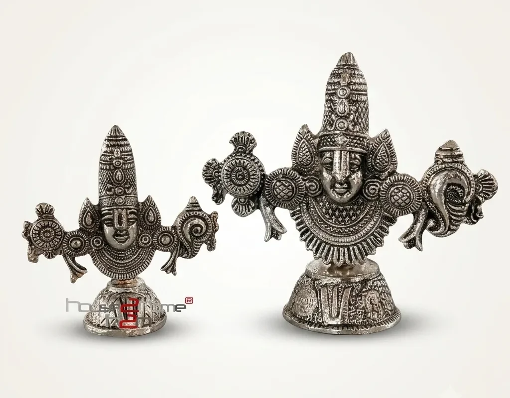 A set of two handcrafted German silver Venkateswara Swamy idols featuring ornate traditional metal engravings.