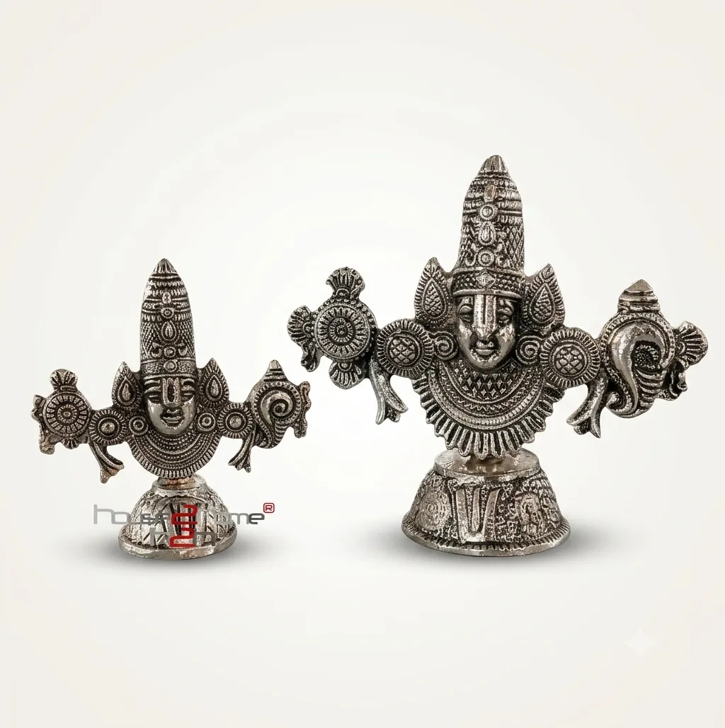 A set of two handcrafted German silver Venkateswara Swamy idols featuring ornate traditional metal engravings.