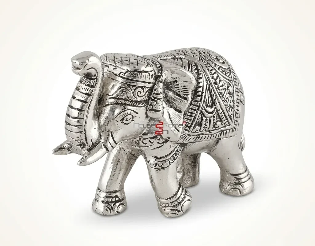 Handcrafted German silver decorative elephant figurine showcasing detailed traditional metal engravings and a polished finish.