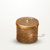 Elegant metallic cutwork container with a small knob on the lid, designed for home decor.