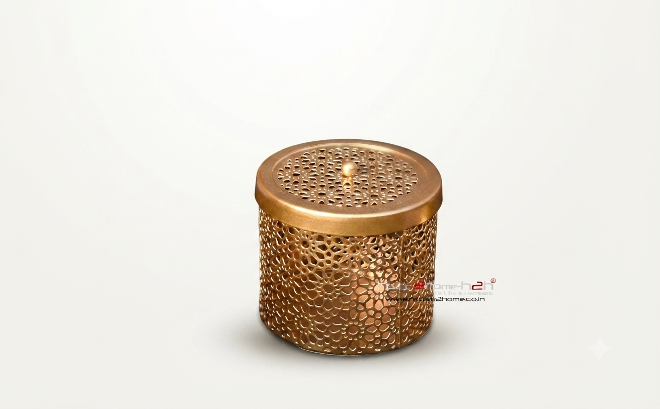 Elegant metallic cutwork container with a small knob on the lid, designed for home decor.