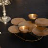 Elegant metal candle holder stand with a multi-level layout crafted by House2Home for tabletop decor.