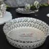 An exquisite metal bowl and dome lid from featuring a brilliant silver finish and delicate leaf reliefs.