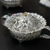 Handcrafted silver colored metal decorative bowl with handles , showcasing a stunning dome cover.