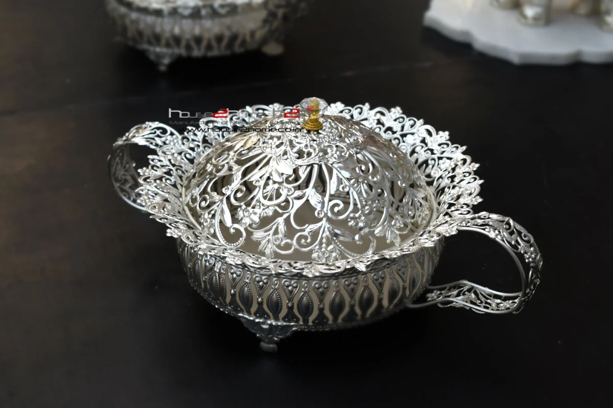 Handcrafted silver colored metal decorative bowl with handles , showcasing a stunning dome cover.