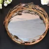 Elegant rose gold metal tray adorned with dimensional flower motifs and a reflective base by House2Home.