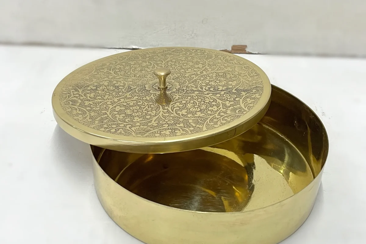 Polished brass dry fruit box with a matching lid featuring detailed floral etchings and a small top handle knob.