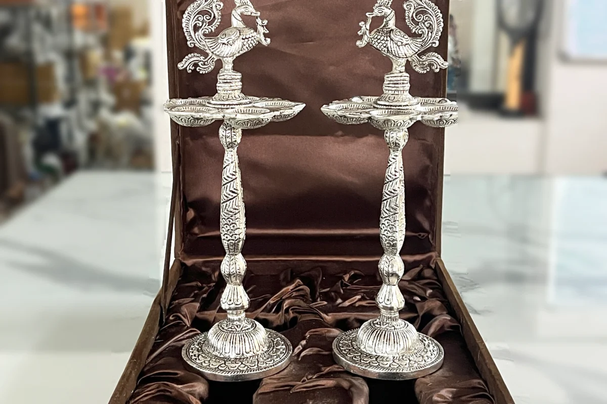 Elegant German silver standing pooja diya in a gift box, wonderful for Griha Pravesh and religious ceremonies.