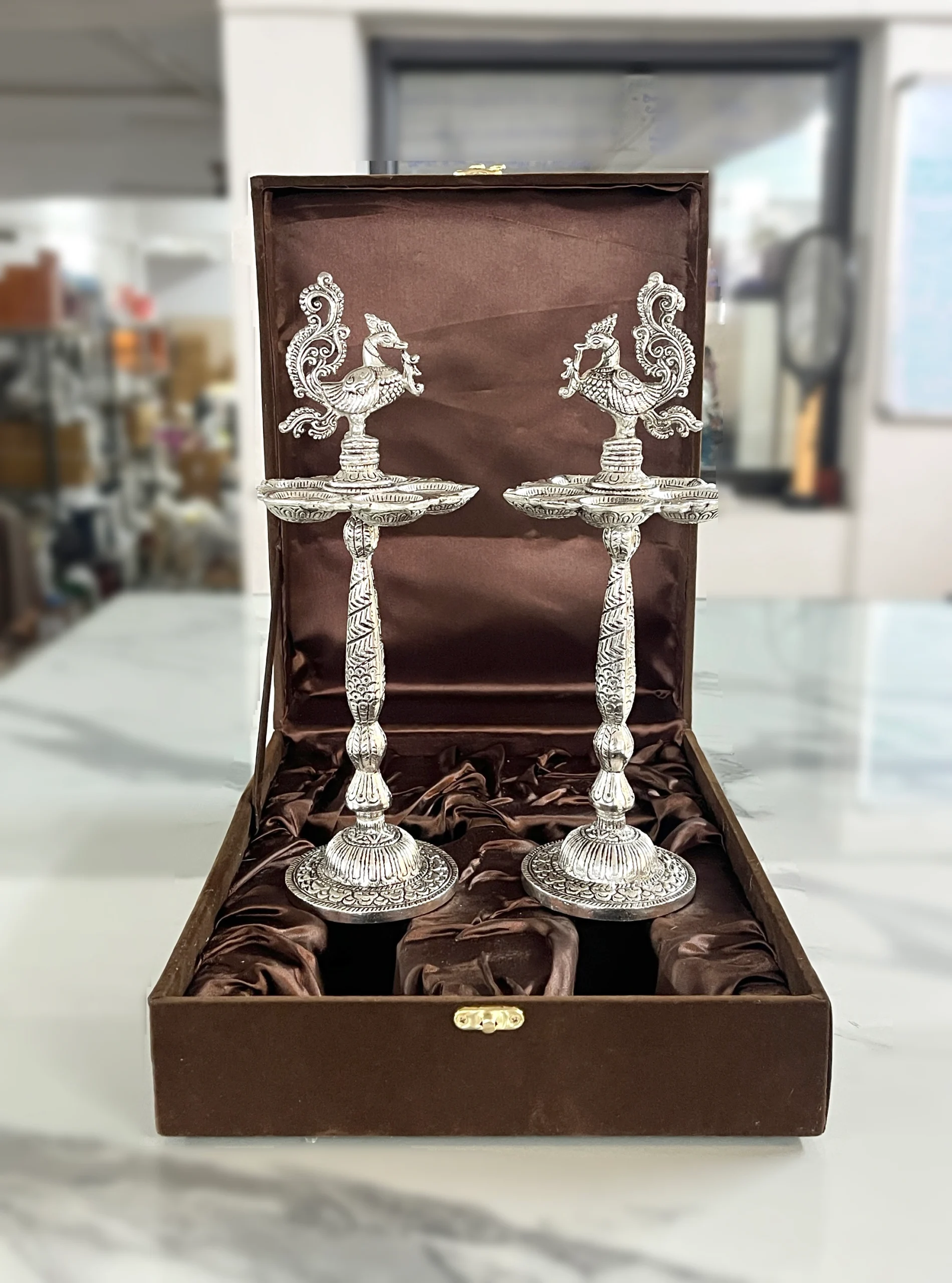 Elegant German silver standing pooja diya in a gift box, wonderful for Griha Pravesh and religious ceremonies.