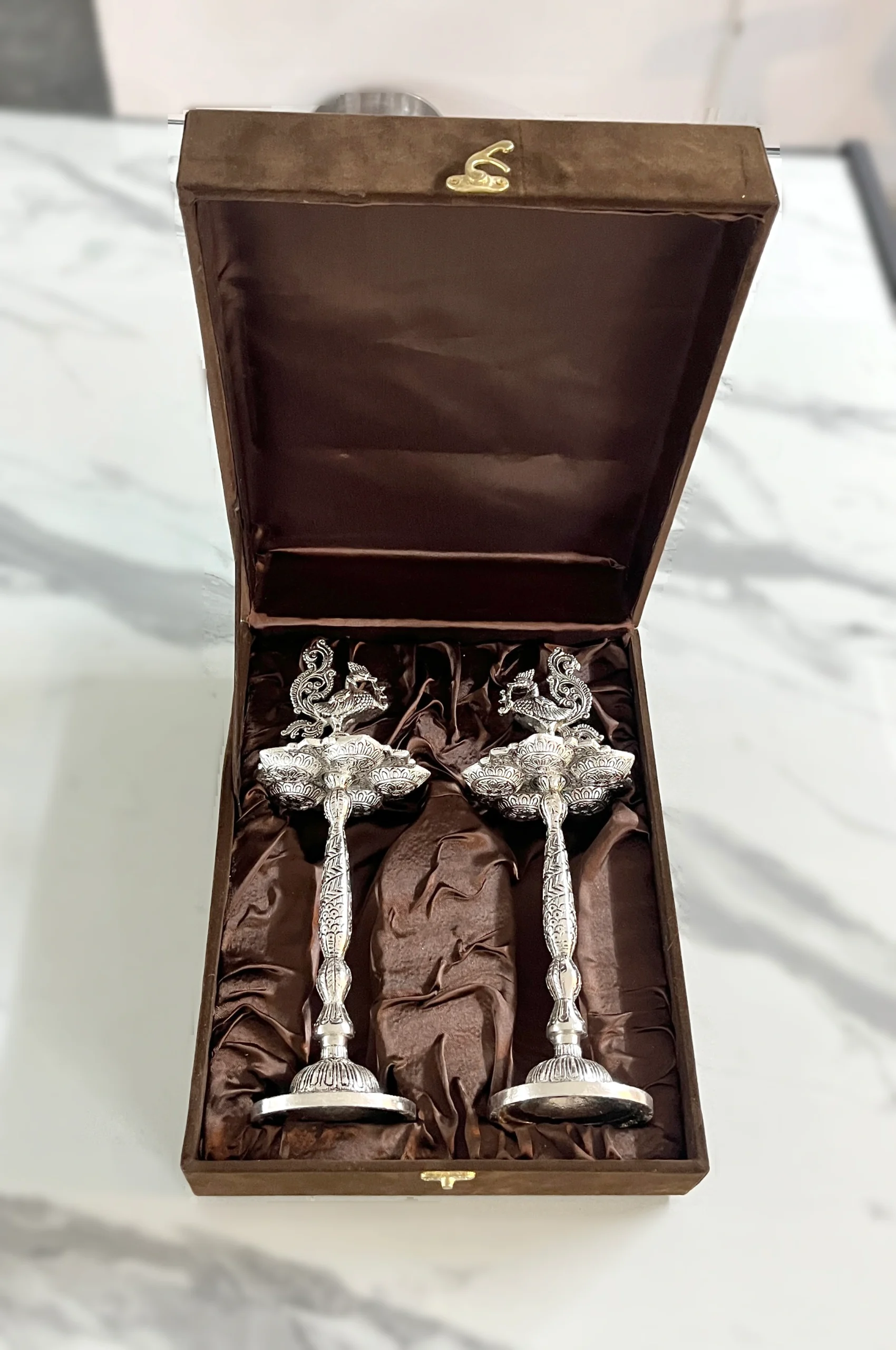 Premium German silver peacock deepam set in custom packaging, suited for high-end corporate festive gifting.