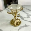Ornate brass elephant centerpiece bowl styled for luxury wedding return gifts and shaadi ceremony gifting hampers.