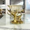 : Golden brass elephant decorative bowl arranged for festive Diwali collections and auspicious Dhanteras gifting.