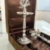 Ornate German silver peacock diya packed in a presentation box, ideal for luxury wedding return gifts.