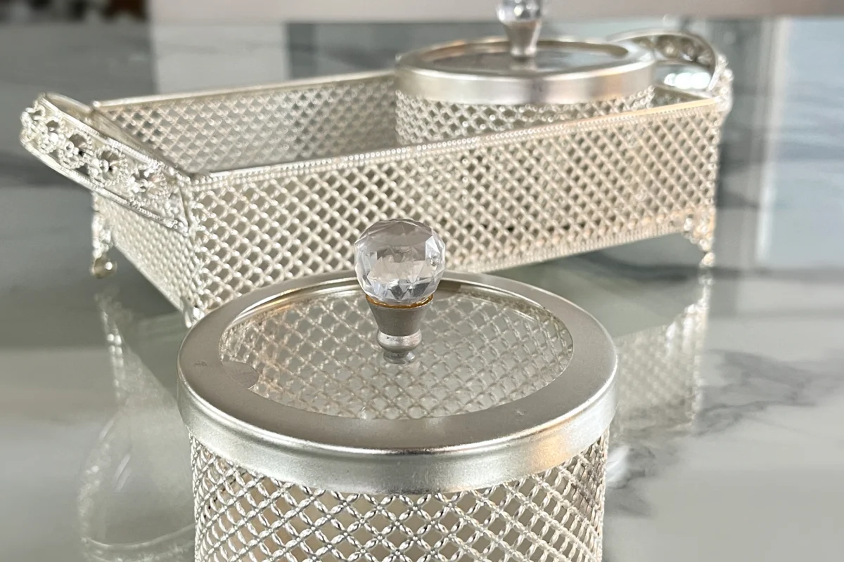 Ornate German silver mesh container set arranged for luxury wedding return gifts and shaadi ceremony hampers.