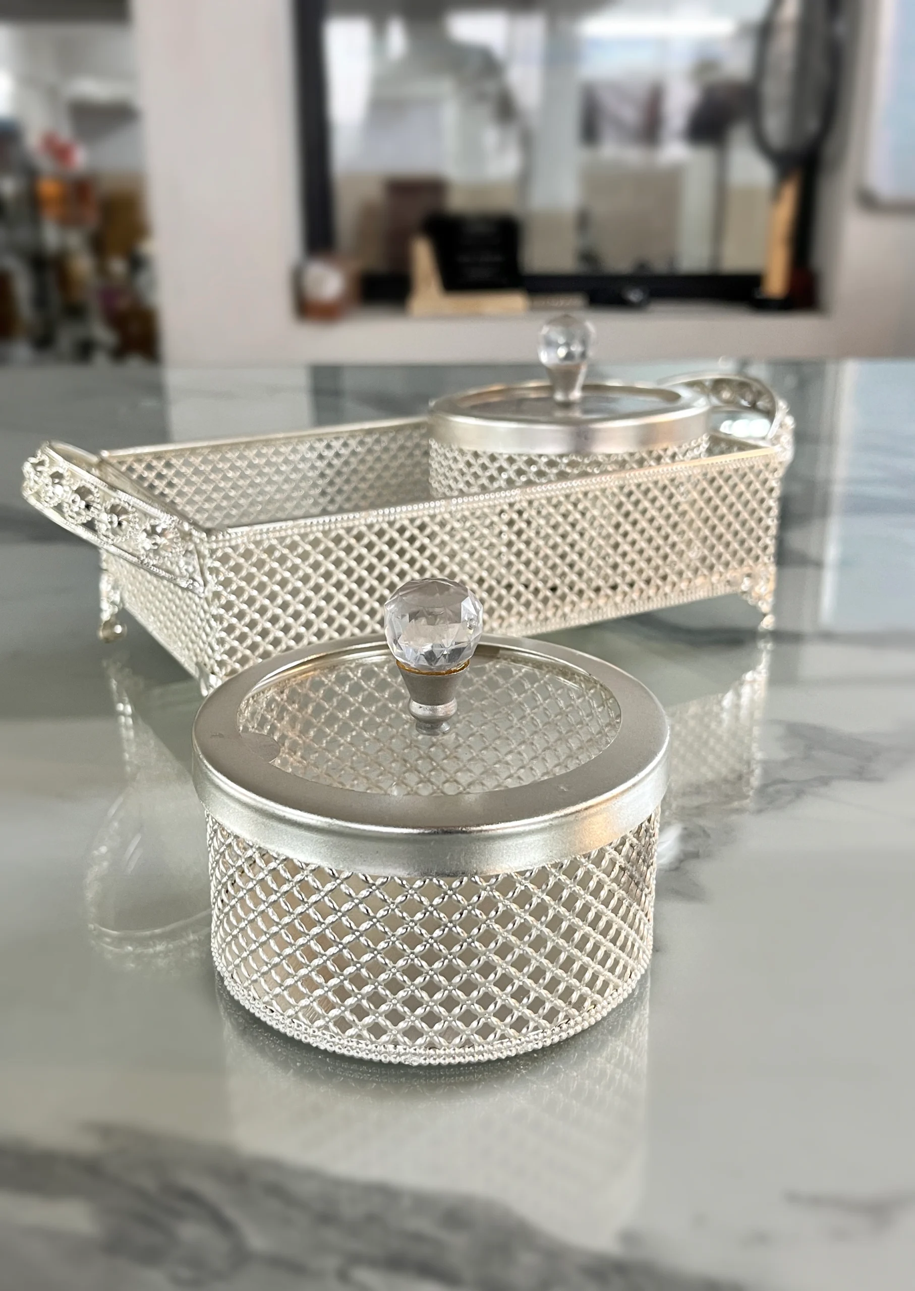 Ornate German silver mesh container set arranged for luxury wedding return gifts and shaadi ceremony hampers.