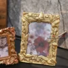 Elegant metal portrait frame with a vintage-inspired artisan border crafted by House2Home for home decor.