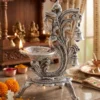 German silver peacock diya presented as a beautiful wedding return gift for shaadi hampers and ceremony gifting.