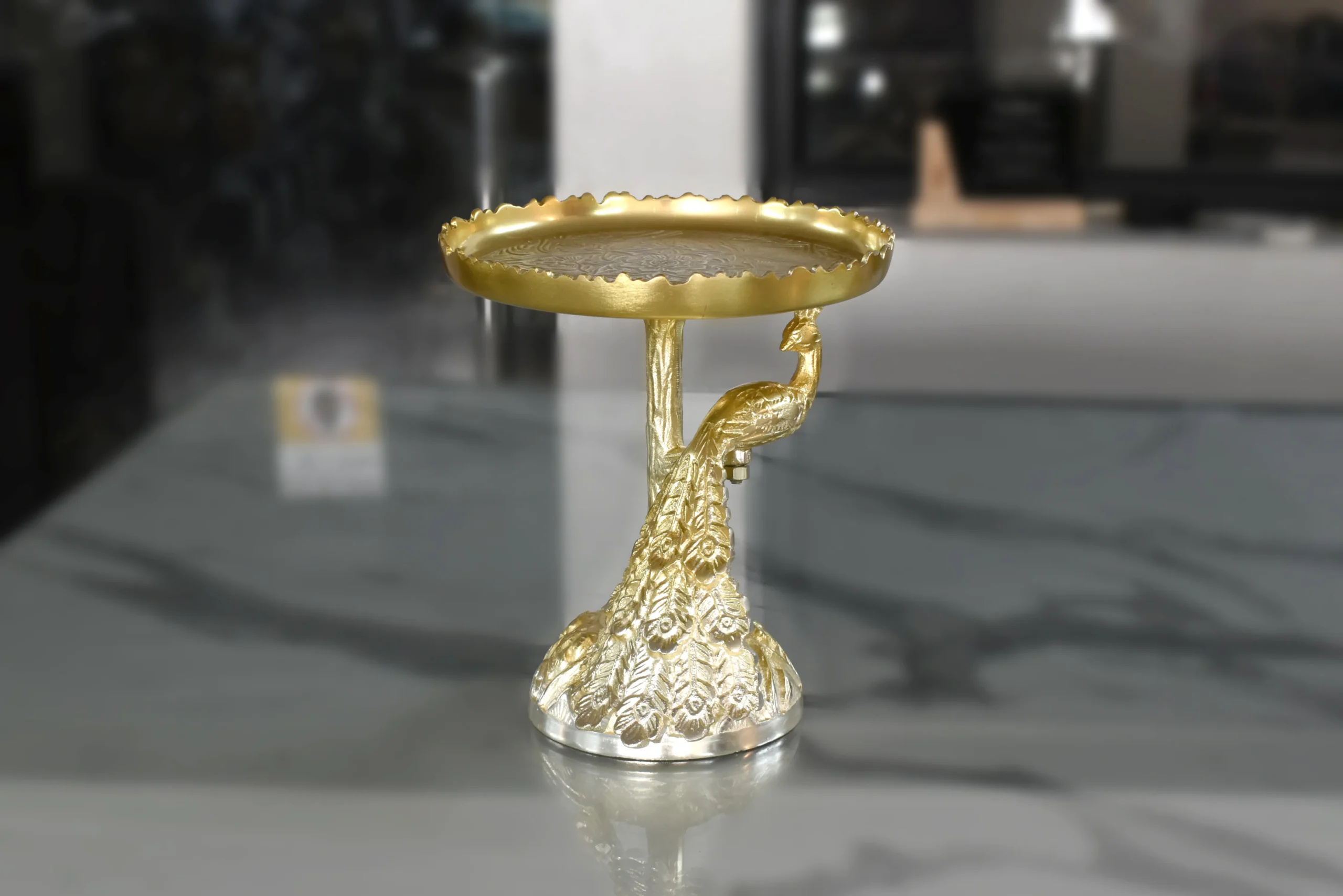 Royal brass peacock pedestal platter designed for luxury wedding return gifts and shaadi hampers