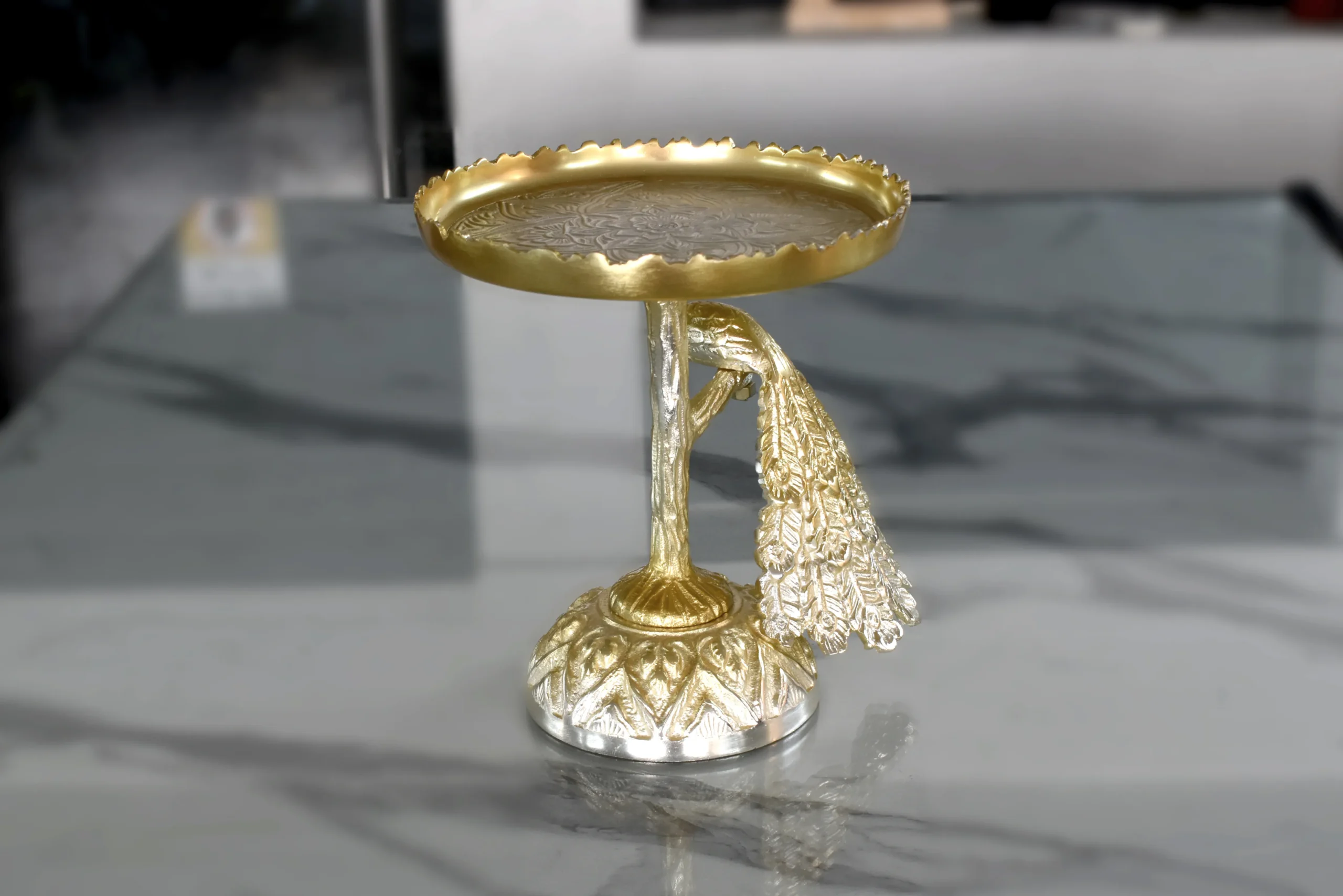 Gold finished peacock pedestal tray styled inside a festive Diwali and Dhanteras gift hamper.